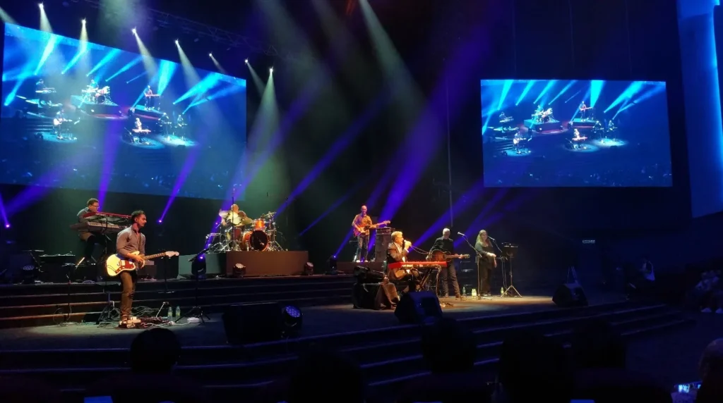 Live band playing on the Auditorium stage under blue lights
