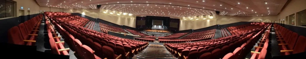 Panoramic view of the empty Auditorium's red seats from the upper level