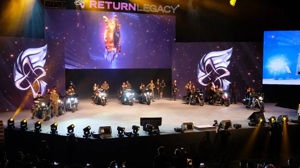 Motorcycles and riders on the Auditorium stage at a Return Legacy recognition night