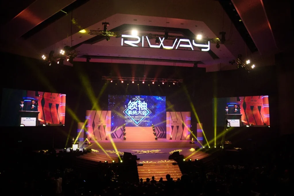 Riway recognition night stage in the Auditorium with coloured lighting and screens
