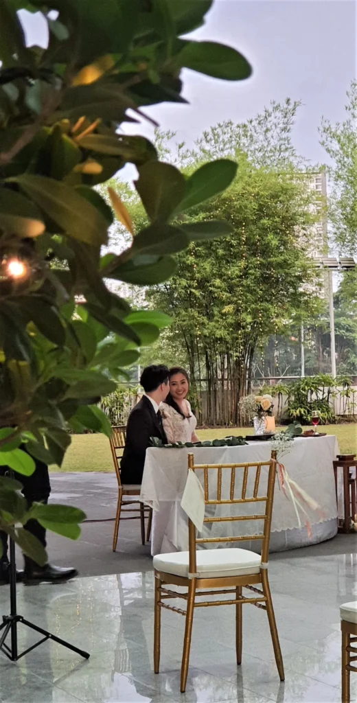 Gold chair and a guest table at the edge of the Garden