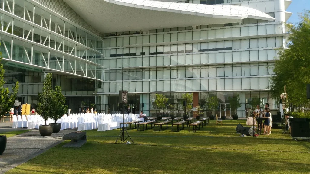 Wedding chairs and tables set on the Garden lawn below the building