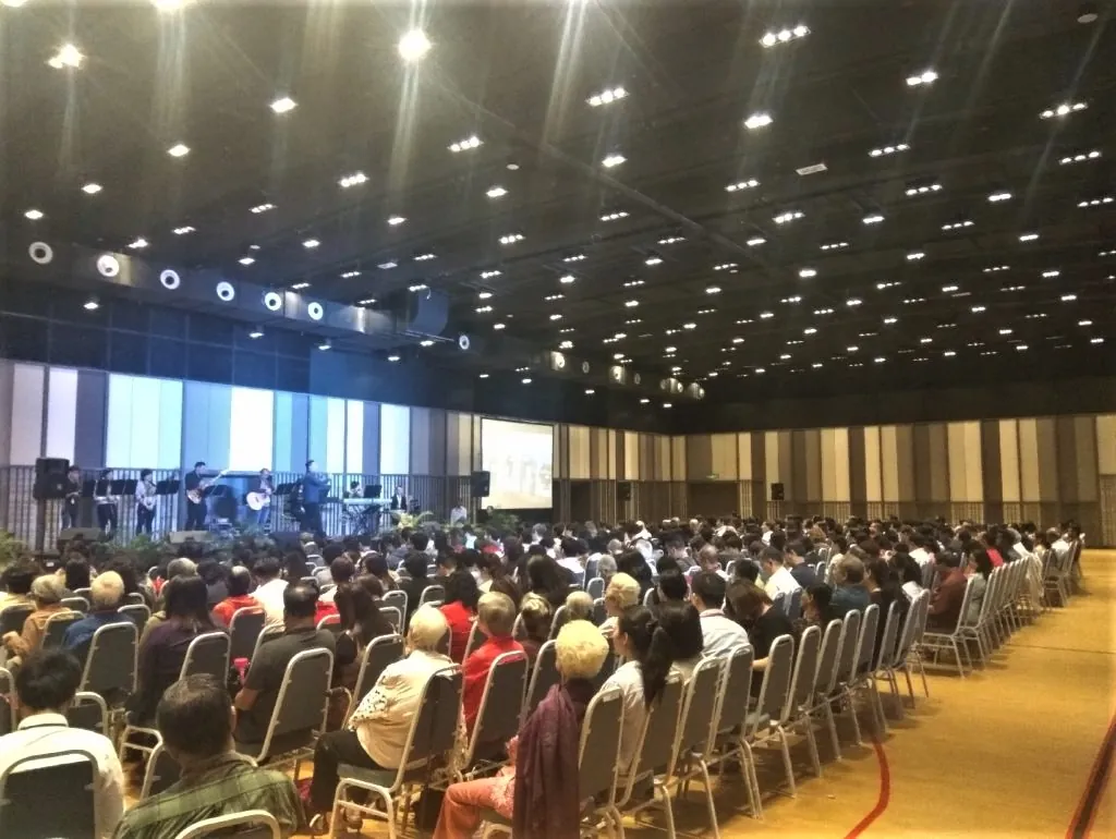 Full audience in rows of chairs facing the stage at a seminar in the Multipurpose Banquet Hall