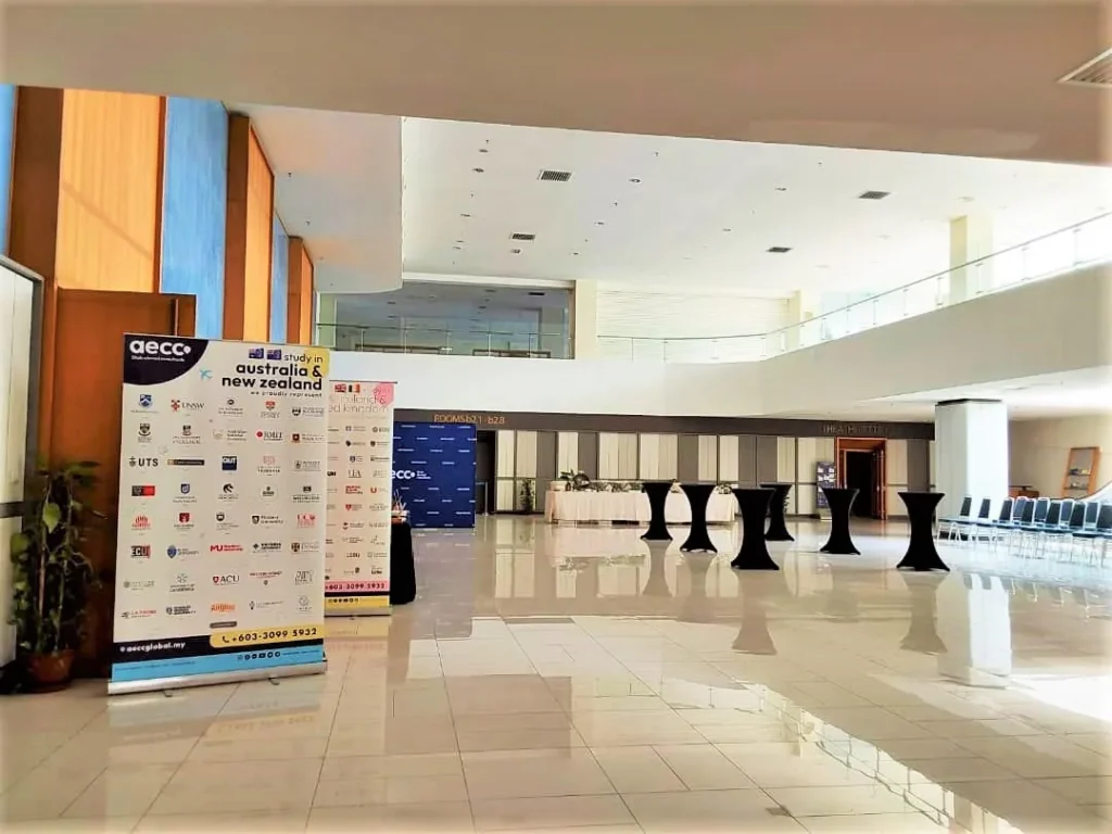 AECC education fair banners and cocktail tables in the Multipurpose Banquet Hall lobby