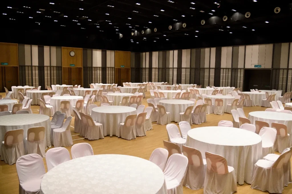 Round tables with white cloths and chairs set up in the Multipurpose Banquet Hall