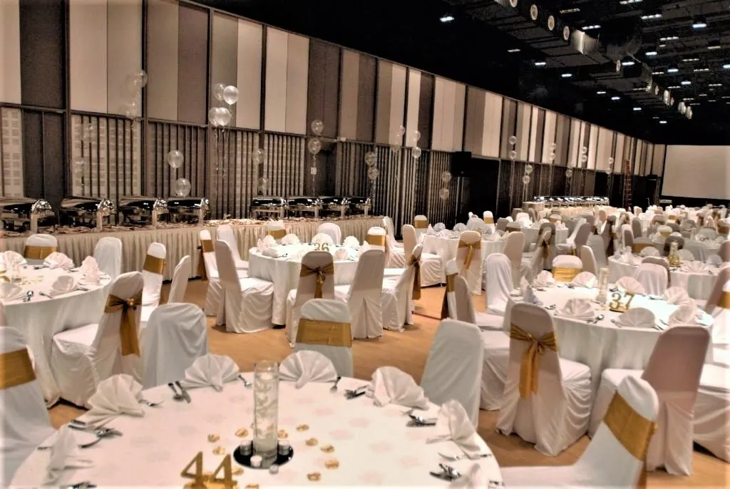 Wedding dinner tables with numbered centrepieces in the Multipurpose Banquet Hall