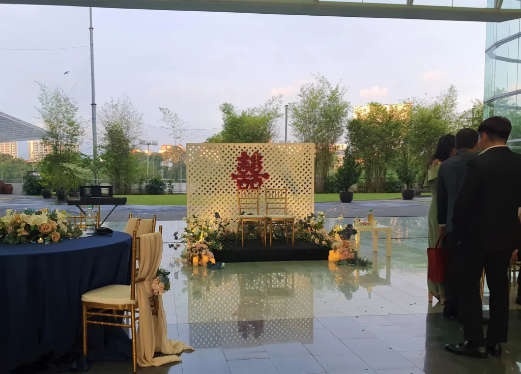 Double happiness backdrop and a guest table set for a Chinese wedding in the Plaza
