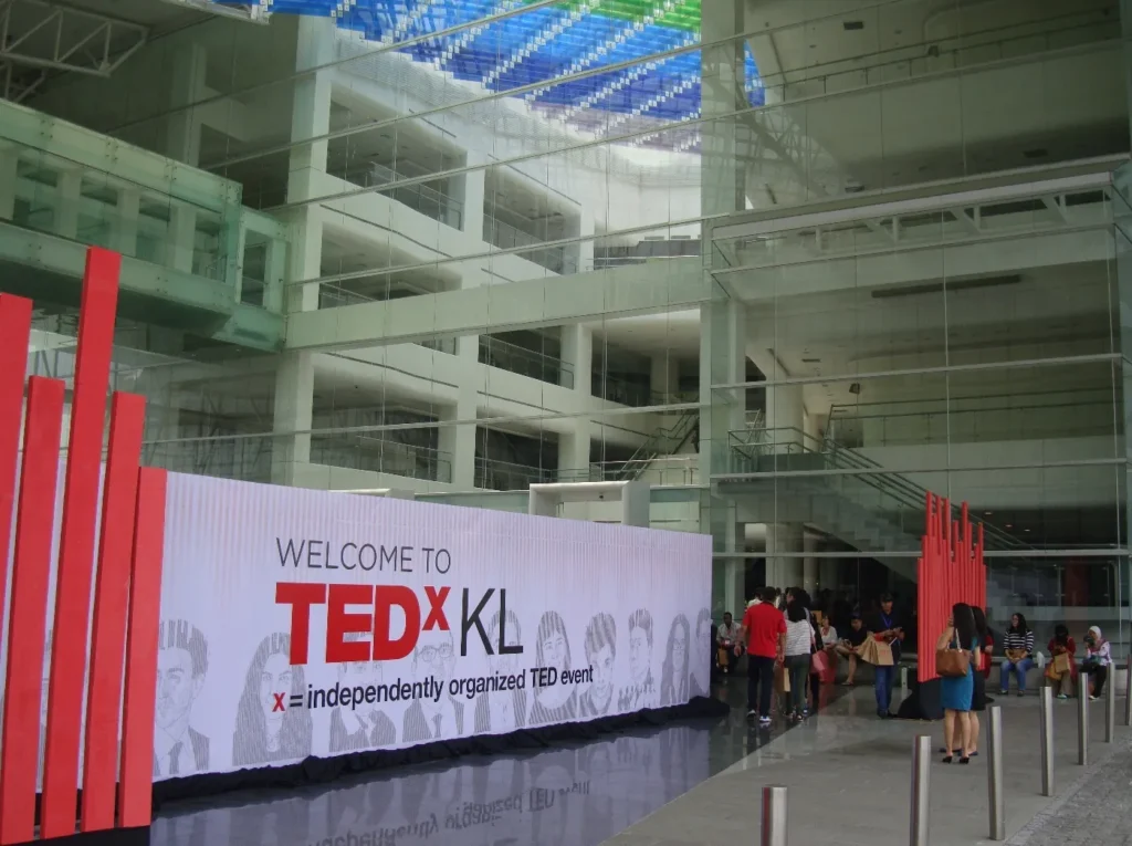 TEDxKL welcome wall and guests in the Plaza