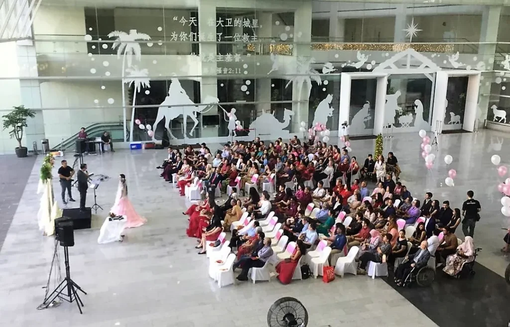 Wedding ceremony guests seated in the Plaza, seen from the level above