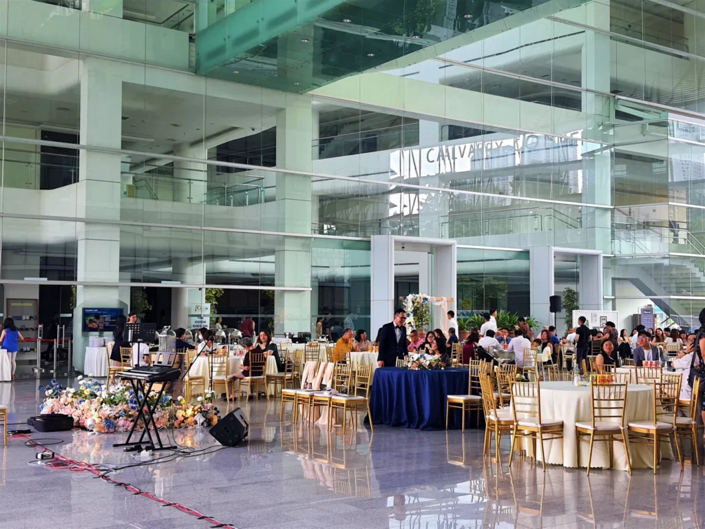 Wedding reception tables and a small band set up in the Plaza