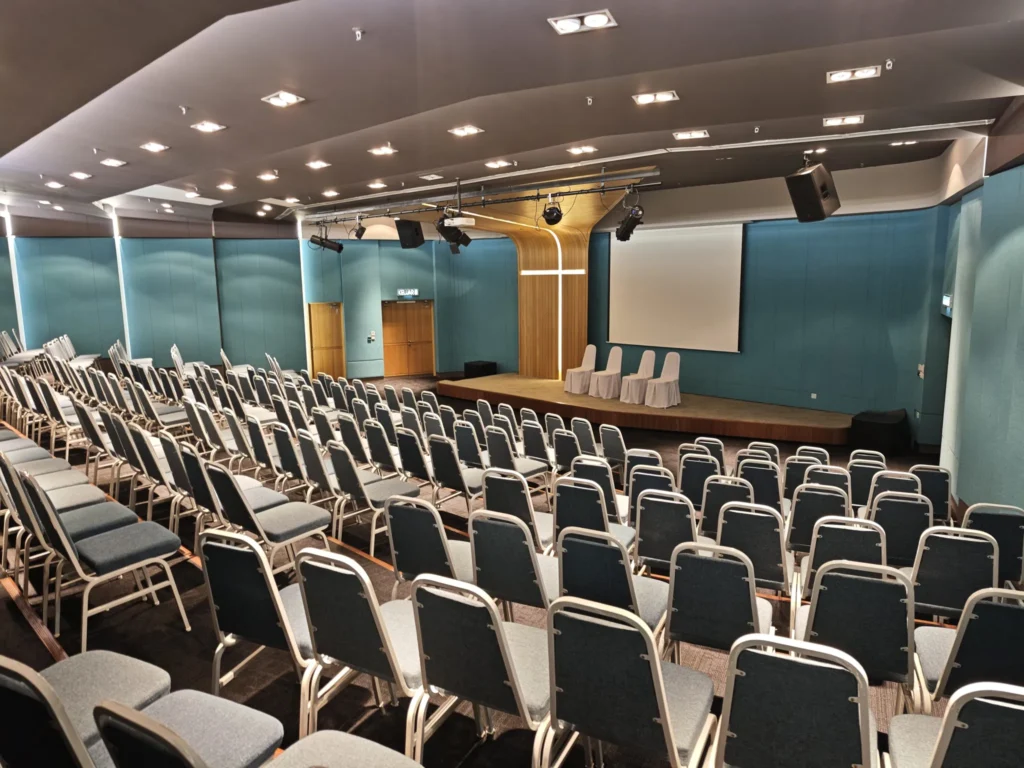 Empty rows of chairs set up for a conference in a Theatrette